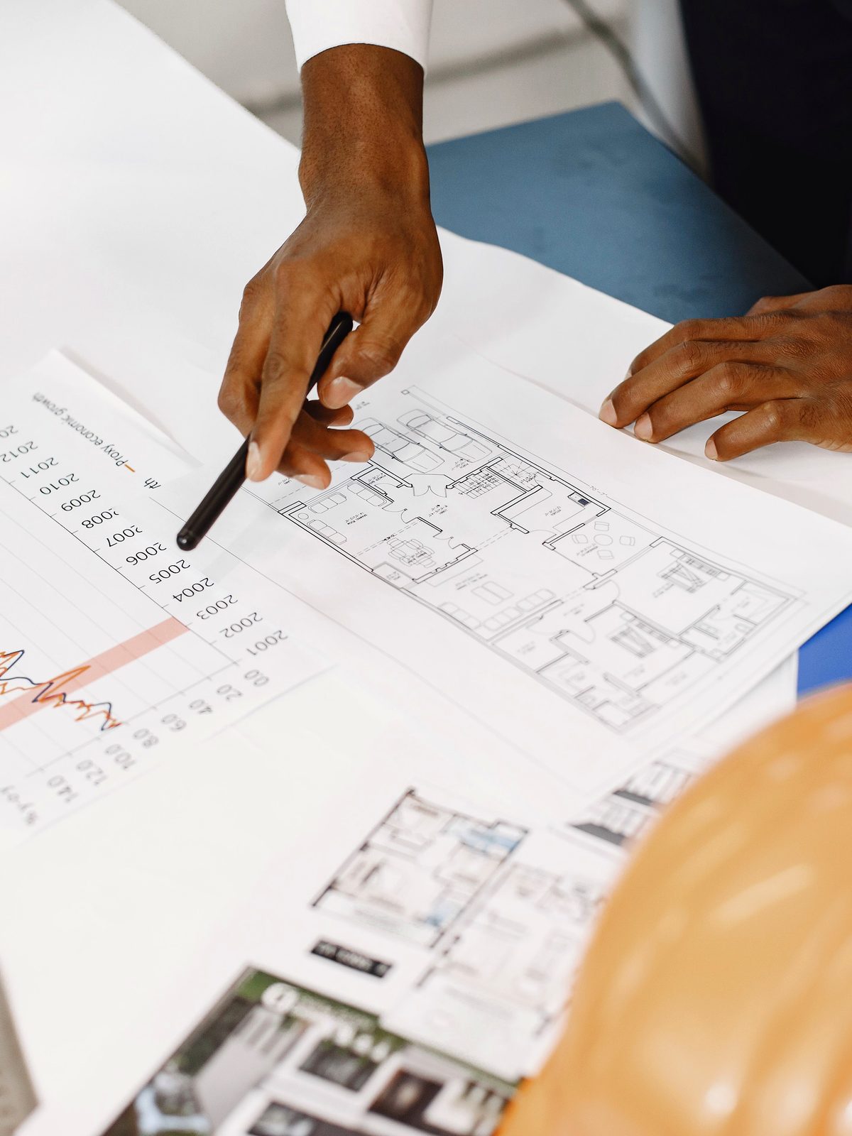 EQ Construction designer reviewing architectural plans