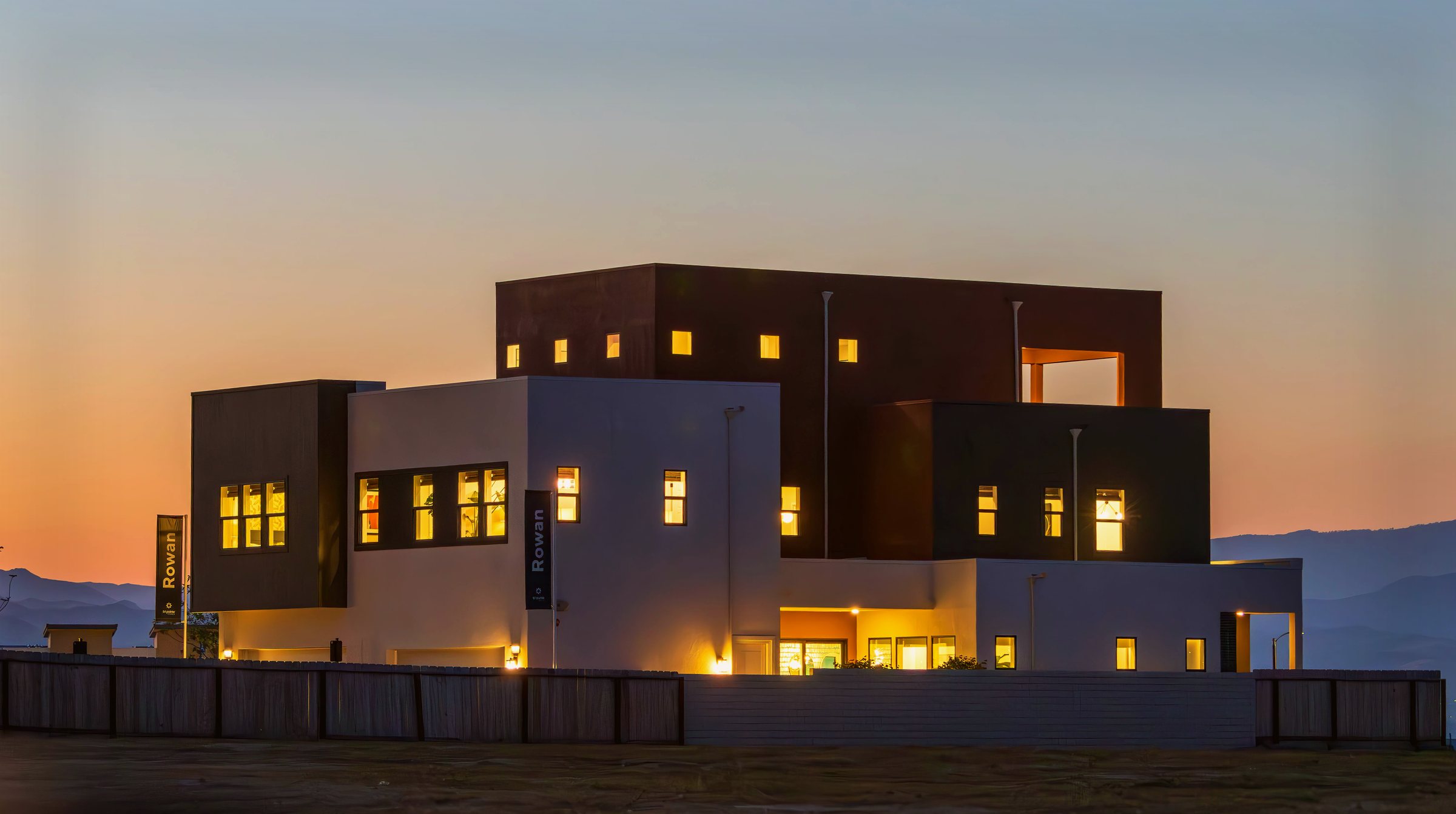 Modern architectural property lit up at dusk